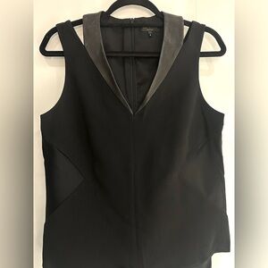 Fitted black top with leather and lace trimmings